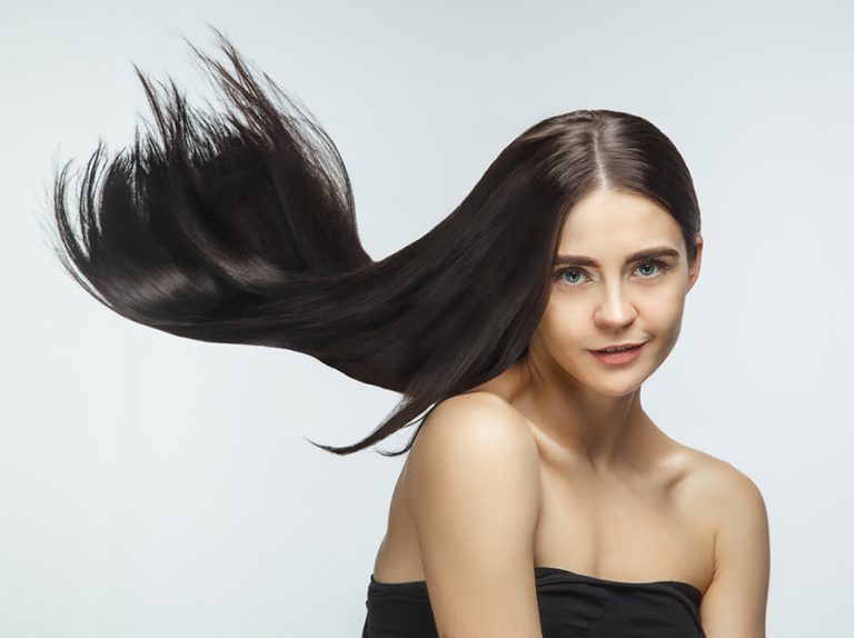 beautiful-model-with-long-smooth-flying-brunette-hair-isolated-white-studio-background